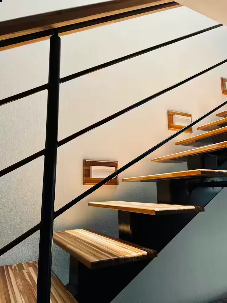 Glass balustrade rail installation with hardware mounting visible